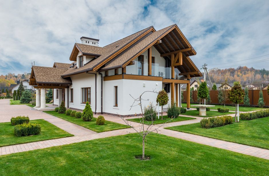 Beautiful home landscaping with lush green grass and manicured garden design